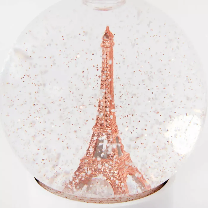 Eiffel Tower glass snow globe, snow and copper glitter - Image 1