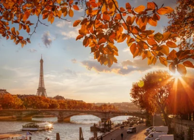 Best time to visit Paris: autumn leaves over the Seine with the Eiffel Tower at sunset